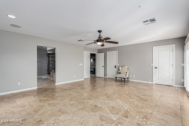 spare room with ceiling fan