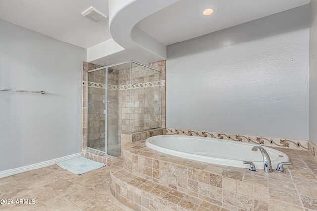 bathroom with independent shower and bath and tile patterned flooring