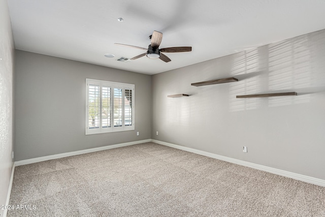 carpeted empty room with ceiling fan