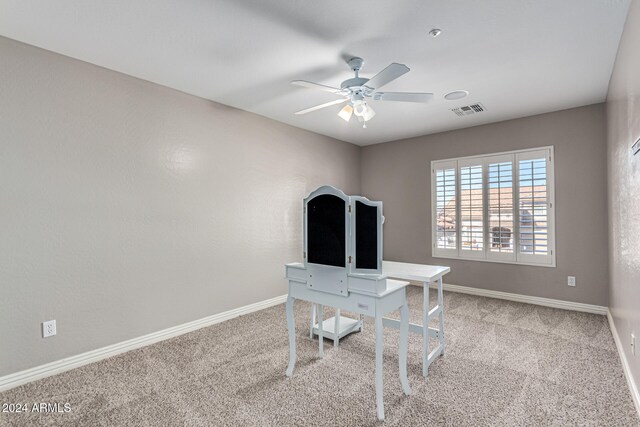 office space with carpet and ceiling fan