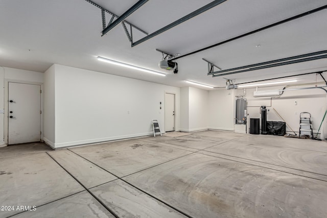 garage with a garage door opener and water heater