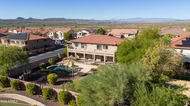 birds eye view of property featuring a mountain view