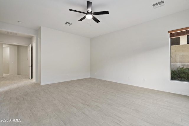 3551 W Hidden Mountain Ln, Anthem, AZ 85086 - empty room with a ceiling fan, visible vents, and light wood-style floors