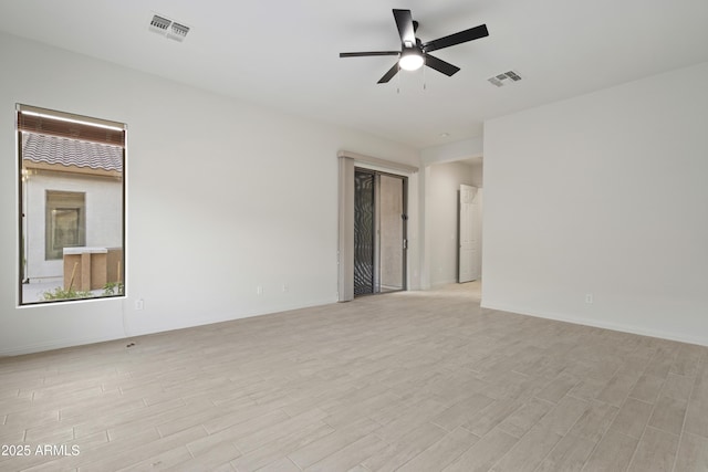 3551 W Hidden Mountain Ln, Anthem, AZ 85086 - empty room with light wood-style floors, visible vents, and ceiling fan
