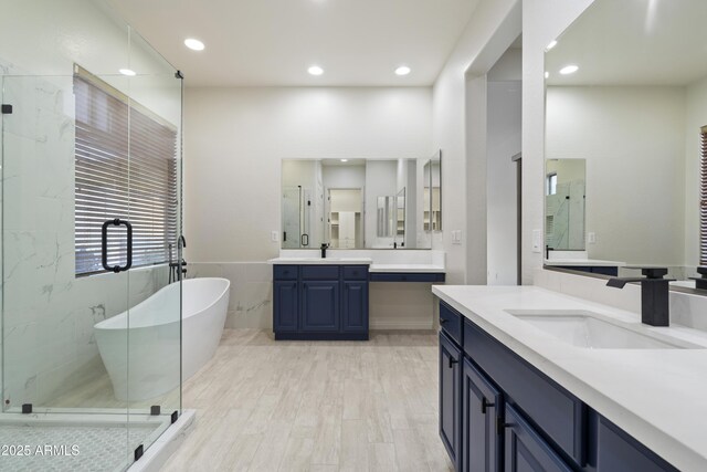 3551 W Hidden Mountain Ln, Anthem, AZ 85086 - full bath featuring recessed lighting, a freestanding bath, a stall shower, and a sink