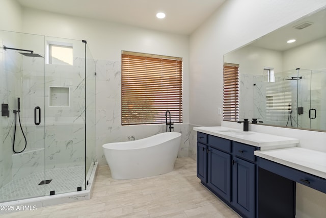 3551 W Hidden Mountain Ln, Anthem, AZ 85086 - full bathroom with a marble finish shower, a soaking tub, visible vents, vanity, and recessed lighting