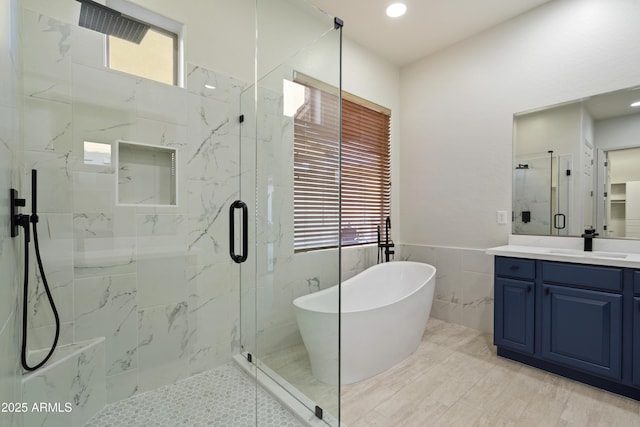 3551 W Hidden Mountain Ln, Anthem, AZ 85086 - bathroom featuring a soaking tub, tile walls, a marble finish shower, and a healthy amount of sunlight