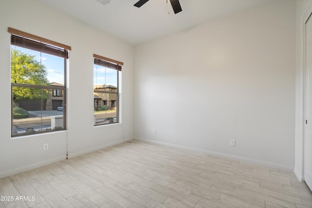 3551 W Hidden Mountain Ln, Anthem, AZ 85086 - unfurnished room featuring baseboards, light wood-style flooring, and ceiling fan