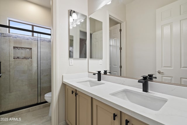 3551 W Hidden Mountain Ln, Anthem, AZ 85086 - full bath with a shower stall, toilet, a sink, and double vanity