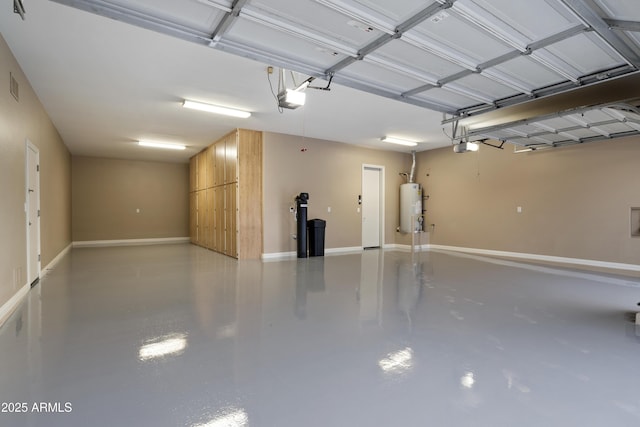 3551 W Hidden Mountain Ln, Anthem, AZ 85086 - garage featuring visible vents, baseboards, a garage door opener, and gas water heater