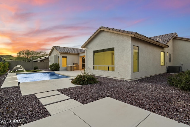 3551 W Hidden Mountain Ln, Anthem, AZ 85086 - rear view of house featuring a patio area, a tile roof, stucco siding, a fenced backyard, and a fenced in pool