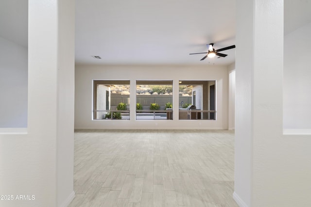 3551 W Hidden Mountain Ln, Anthem, AZ 85086 - unfurnished room with baseboards, visible vents, and wood finished floors