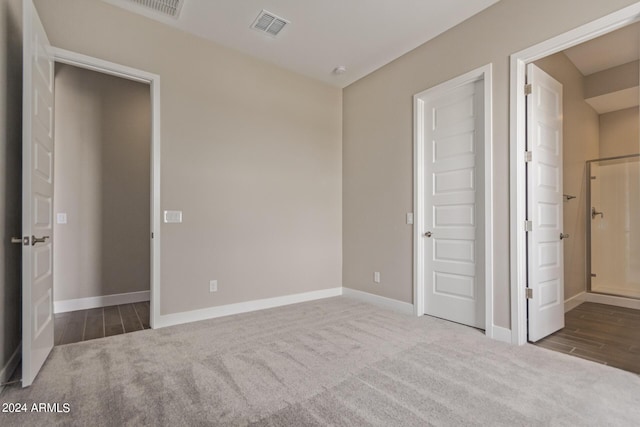 unfurnished bedroom with carpet flooring