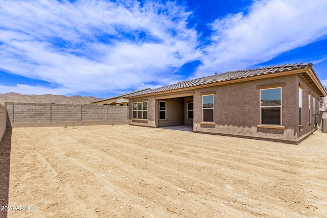 rear view of house with a mountain view