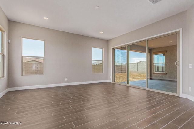 unfurnished room featuring dark wood-type flooring