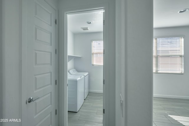 laundry room featuring separate washer and dryer