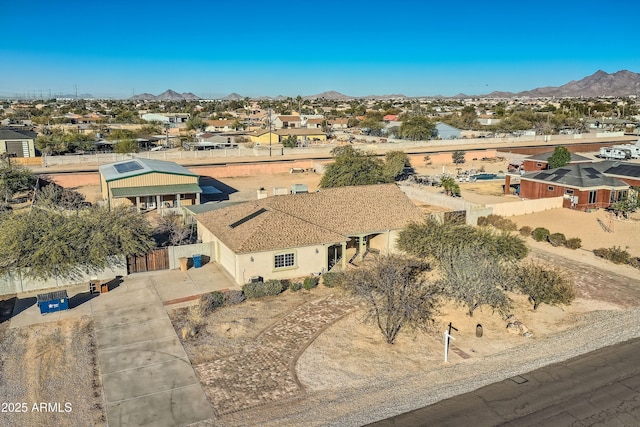 birds eye view of property featuring a mountain view