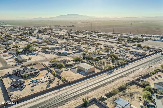 birds eye view of property with a mountain view