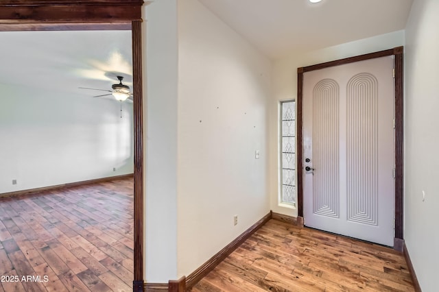 entrance foyer with ceiling fan and light hardwood / wood-style flooring