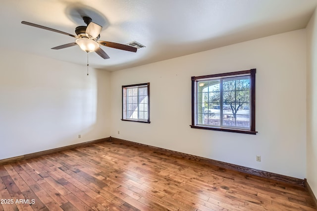 unfurnished room featuring hardwood / wood-style flooring and ceiling fan