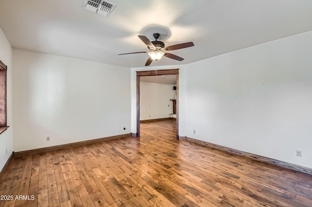 spare room featuring ceiling fan and wood-type flooring