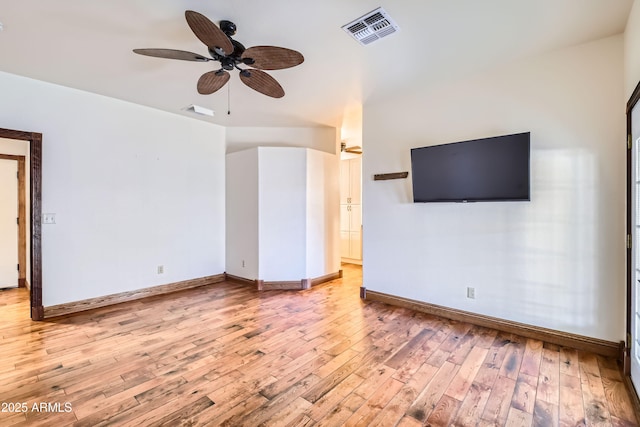 unfurnished living room featuring ceiling fan and light wood-type flooring