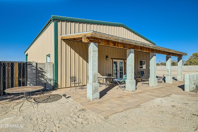 back of house featuring a patio area and french doors