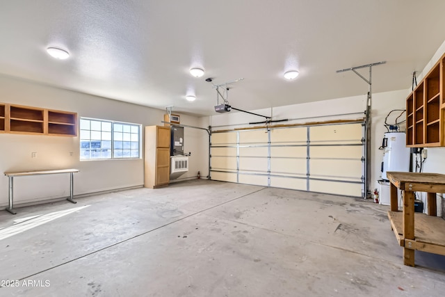 garage featuring a garage door opener and water heater