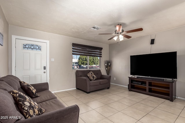 living room with ceiling fan and light tile patterned floors