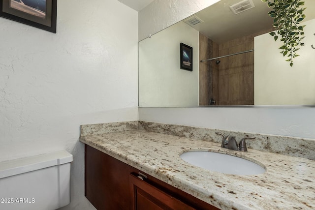 bathroom with toilet and vanity