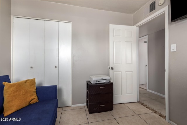 sitting room with light tile patterned floors