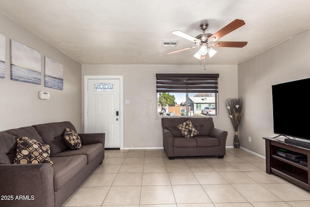 living room featuring ceiling fan and light tile patterned floors