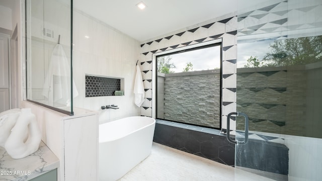 4434 E Camelback Rd Unit 128, Phoenix, AZ 85018 - bathroom with a freestanding tub and a walk in shower