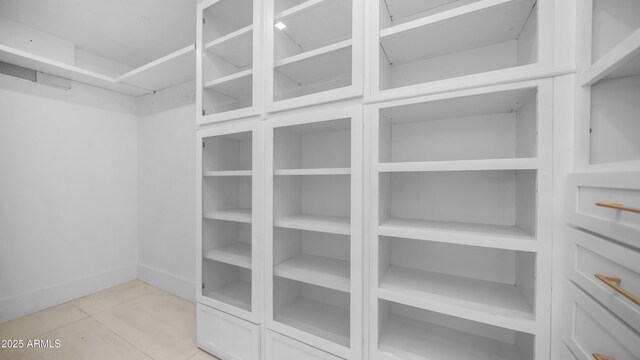 4434 E Camelback Rd Unit 128, Phoenix, AZ 85018 - spacious closet with light tile patterned floors