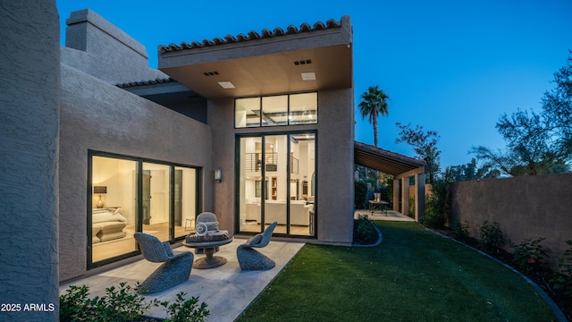 4434 E Camelback Rd Unit 128, Phoenix, AZ 85018 - rear view of house featuring a patio area, stucco siding, and a tile roof