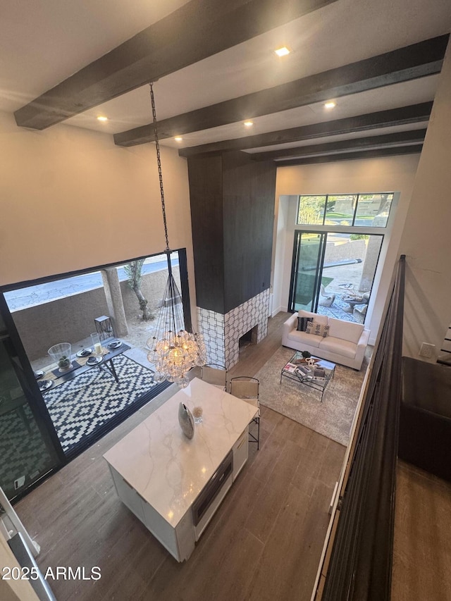 living room featuring beamed ceiling, recessed lighting, and dark wood-style flooring