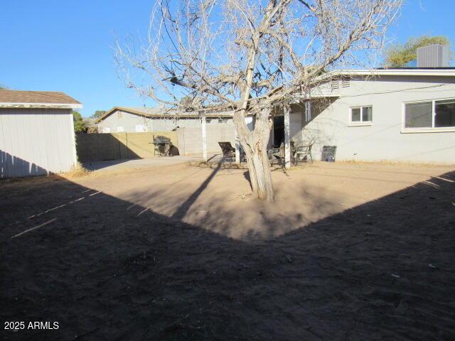 back of house with a patio