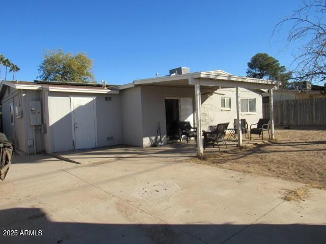 rear view of house featuring a patio