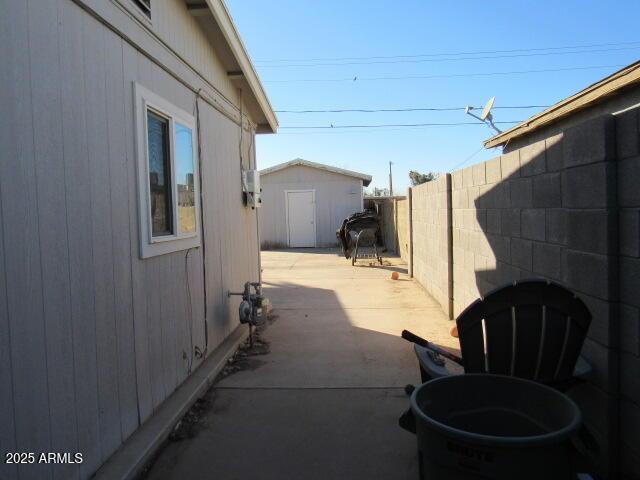 view of patio / terrace with a storage unit