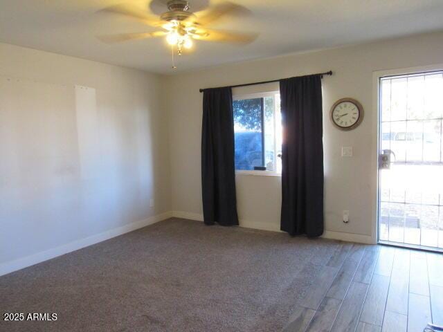 spare room featuring ceiling fan and wood-type flooring