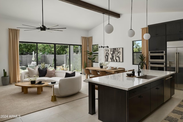 2916 E Sells Dr, Phoenix, AZ 85016 - kitchen featuring dark cabinets, a sink, appliances with stainless steel finishes, and beam ceiling