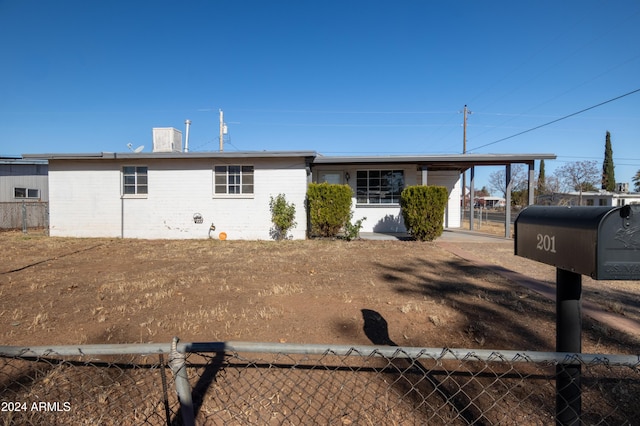 view of front facade with a carport