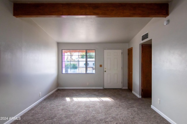 interior space featuring lofted ceiling with beams