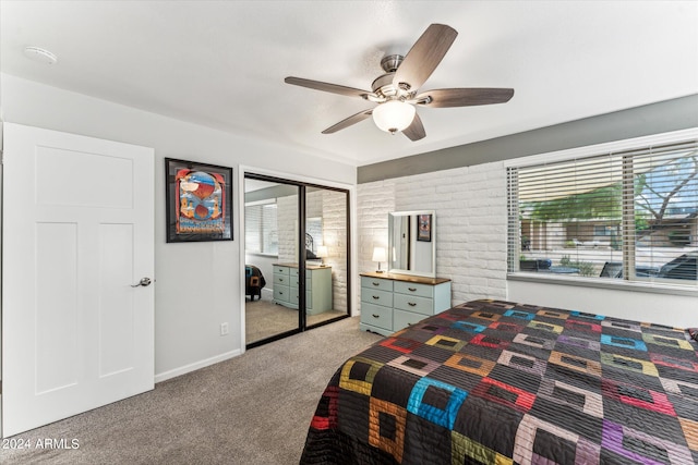 carpeted bedroom with a closet and ceiling fan