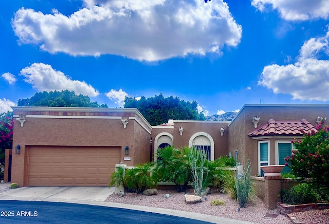 10838 N 10th St, Phoenix, AZ 85020 - view of front of home featuring stucco siding, an attached garage, and driveway