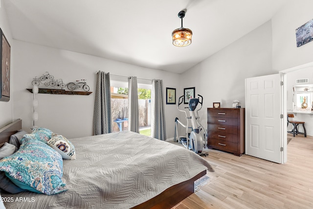 10838 N 10th St, Phoenix, AZ 85020 - bedroom featuring light wood finished floors, high vaulted ceiling, and baseboards