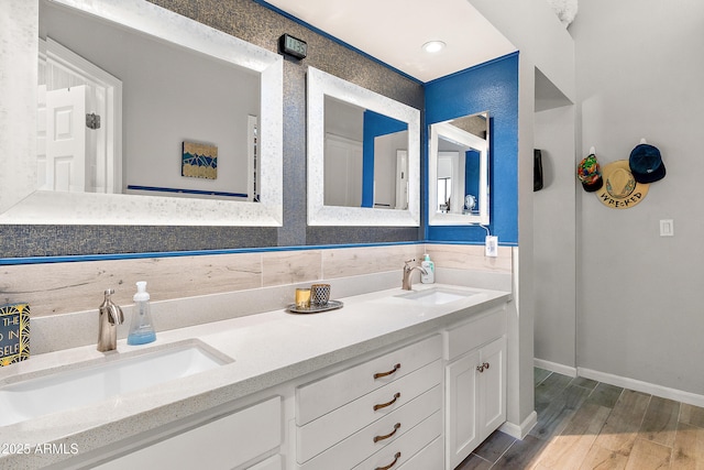 10838 N 10th St, Phoenix, AZ 85020 - full bath featuring double vanity, wood finished floors, and baseboards