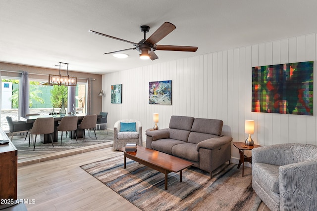 10838 N 10th St, Phoenix, AZ 85020 - living area featuring wood finished floors, a ceiling fan, and baseboards