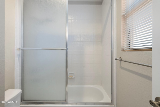 7503 W Julie Dr, Glendale, AZ 85308 - full bath featuring toilet, combined bath / shower with glass door, and a textured wall
