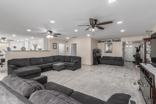 living room featuring ceiling fan and light carpet